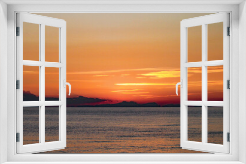 Fototapeta Naklejka Na Ścianę Okno 3D - A perfect golden sunset over a calm sea