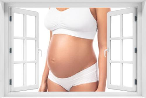 Pregnant woman wearing lingerie on white background