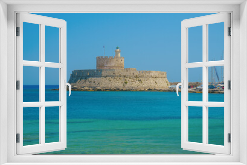 Fototapeta Naklejka Na Ścianę Okno 3D - Agios Nikolaos fortress on the Mandraki harbour of Rhodes Greece