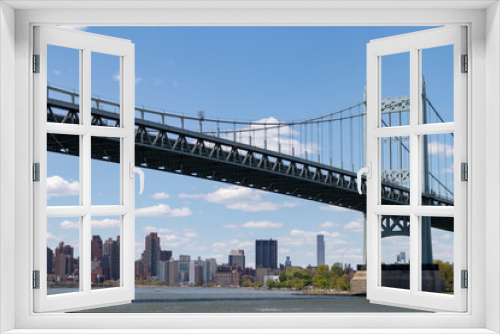 Fototapeta Naklejka Na Ścianę Okno 3D - The Triborough Bridge connecting Astoria Queens New York to Wards and Randall's Island over the East River with the Manhattan Skyline