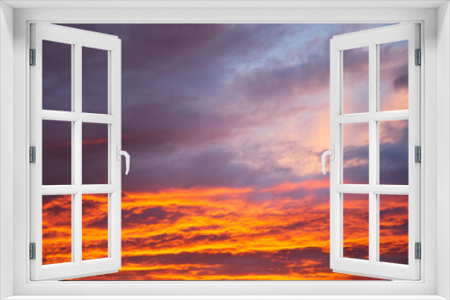 Fototapeta Naklejka Na Ścianę Okno 3D - Dramatic sunset vivid orange colored clouds 