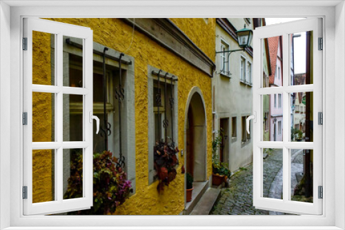 Fototapeta Naklejka Na Ścianę Okno 3D - Narrow medieval street in old town Rothenburg ob der Tauber, Bavaria, Germany. November 2014