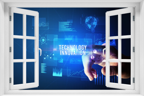 Hand touching TECHNOLOGY INNOVATION inscription, new business technology concept