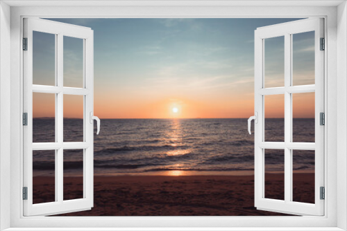 Fototapeta Naklejka Na Ścianę Okno 3D - Sunset at the beach in the evening Holiday and Travel Concept