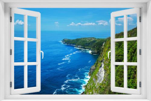 Fototapeta Naklejka Na Ścianę Okno 3D - A view of a cliff and blue sea in Bali, Indonesia.