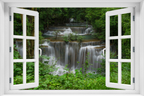 Fototapeta Naklejka Na Ścianę Okno 3D - Beautiful natural landscape scene of waterfall in rain forest with green trees in long exposure photography