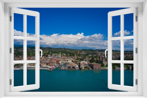 Fototapeta Naklejka Na Ścianę Okno 3D - Lazise, Lake Garda, Italy. Aerial view of the historic part of Scaliger Castle of Lazise in the background cumulus clouds in the blue sky