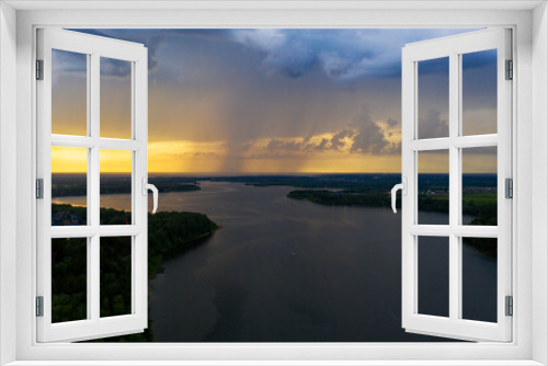 Fototapeta Naklejka Na Ścianę Okno 3D - panoramic view of the river with floating boats and beautiful clouds shot from a drone