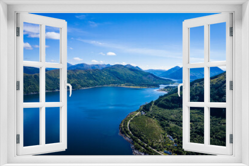 Fototapeta Naklejka Na Ścianę Okno 3D - aerial image of the entrance to glencoe, ballachulish and loch leven from loch linnhe on the west coast of the argyll and lochaber region of the highlands of scotland on a clear blue sky summer day
