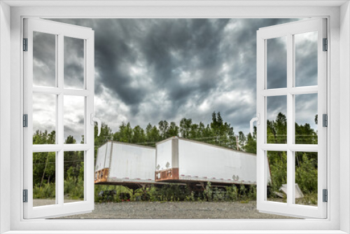Fototapeta Naklejka Na Ścianę Okno 3D - Parked semi-truck trailers on a dirt road in Alaska