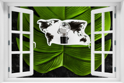 Fototapeta Naklejka Na Ścianę Okno 3D - ideas for ecology and the environment concept, lightbulb and world map on top of tropical leaf