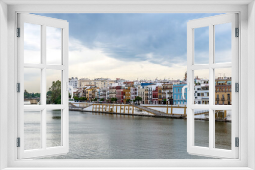 It's Guadalquivir river coast and architecture of Seville, Andalusia, Spain.