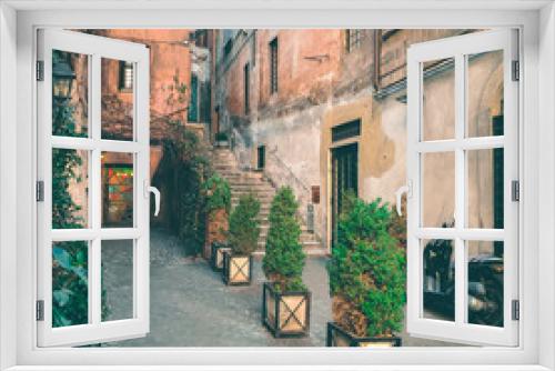 Fototapeta Naklejka Na Ścianę Okno 3D - View of old cozy street in Rome, Italy. Architecture and landmark of Rome. Postcard of Rome