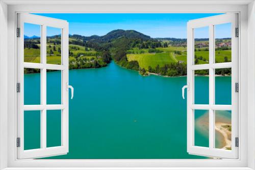 Fototapeta Naklejka Na Ścianę Okno 3D - Aerial view over Lake Forggensee at the city of Fuessen in Bavaria Germany