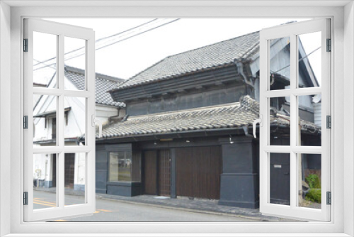 Fototapeta Naklejka Na Ścianę Okno 3D - Merchant house with warehouse  made of earth and plaster on Nikko highway in Utsunomiya city, Tochigi prefecture.