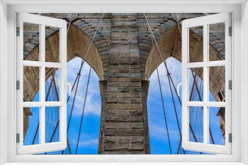 Fototapeta Naklejka Na Ścianę Okno 3D - Closeup of the pointed arches above the passageways through the stone towers of the Brooklyn bridge in New York City USA