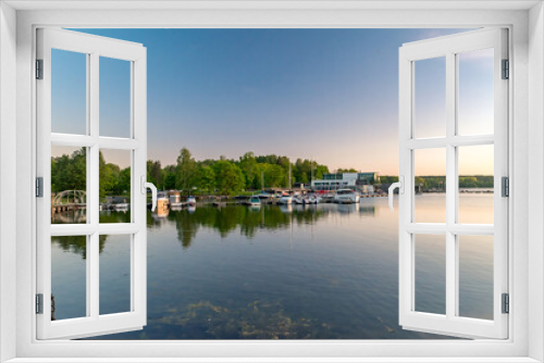 Fototapeta Naklejka Na Ścianę Okno 3D - Panoramic view on Ukiel lake with marina at sunset time.