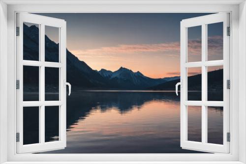 Fototapeta Naklejka Na Ścianę Okno 3D - Sunrise on rocky mountains with colorful sky on Medicine Lake, Jasper national park