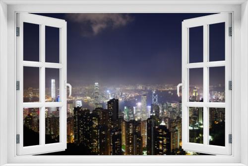 Fototapeta Naklejka Na Ścianę Okno 3D - Night over Victoria Harbor as viewed atop Victoria Peak in Hong Kong, China