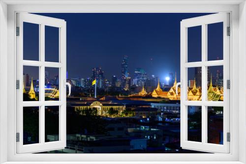 Fototapeta Naklejka Na Ścianę Okno 3D - Bangkok , Thailand - 19 June, 2020: Panorama view of Wat Phra Keaw Public landmark in Thailand in night time and city in background 