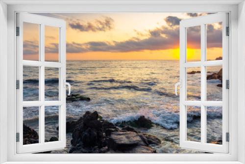 Fototapeta Naklejka Na Ścianę Okno 3D - beach of the sea at sunset. wonderful scenery with stones in the water. beautiful clouds above the sun and horizon. concept of zen mood and spirituality