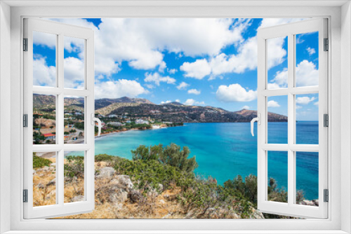 Fototapeta Naklejka Na Ścianę Okno 3D - 
Coast of a greek island in the mediterranean sea. A bay with beautiful blue clear water, with a beach, on a background of mountains.