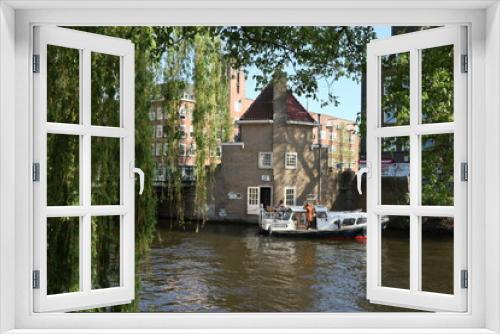 Fototapeta Naklejka Na Ścianę Okno 3D - Amsterdam, North-Holland, The Netherlands - April 2, 2020: Amstelkade view.