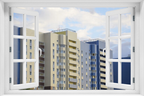 Fototapeta Naklejka Na Ścianę Okno 3D - Multi-storey, residential new home on a sunny day.