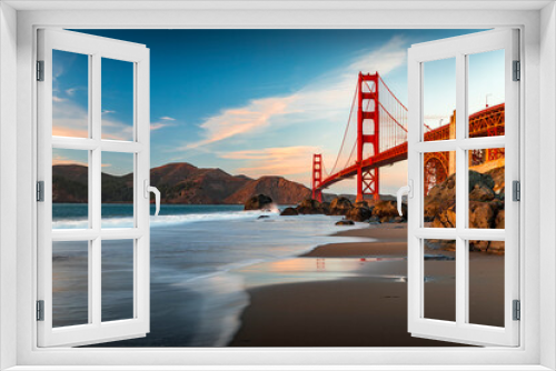 Fototapeta Naklejka Na Ścianę Okno 3D - Golden Gate Bridge view from the hidden and secluded rocky Marshall's Beach at sunset in San Francisco, California