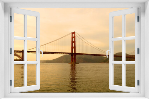Fototapeta Naklejka Na Ścianę Okno 3D - San Francisco 2013, The smooth curve of the Golden gate Bridge in the bay with nice dusk colors