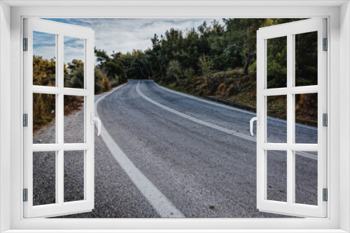 Fototapeta Naklejka Na Ścianę Okno 3D - Cinematic road landscape. Lesbos Island, Greece. Misty road