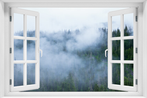 Fototapeta Naklejka Na Ścianę Okno 3D - Misty windy mountain forest road