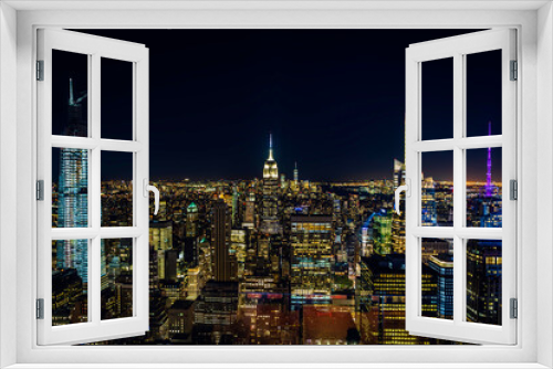 New York City, USA. Night aerial view of Midtown Manhattan skyscrapers from a high viewpoint.