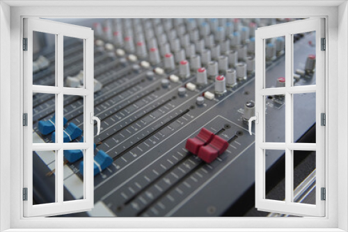 Sound amplifier and equalizer studio mixer control panel for sound recording. Selective focus.