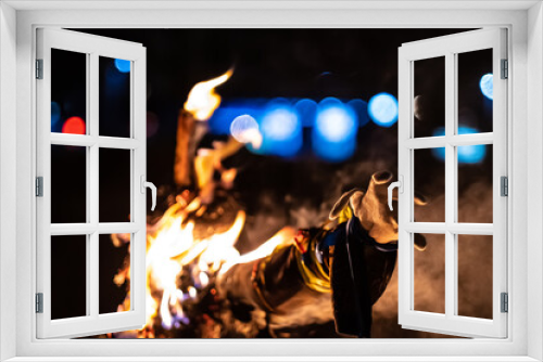 Fototapeta Naklejka Na Ścianę Okno 3D - Scarecrow enveloped in flames, left hand close up