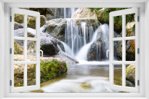 Fototapeta Naklejka Na Ścianę Okno 3D - A little waterfall in a park