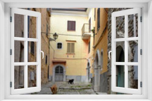 Fototapeta Naklejka Na Ścianę Okno 3D - A street between the houses of the old town of Santa Maria del Molise, Italy.