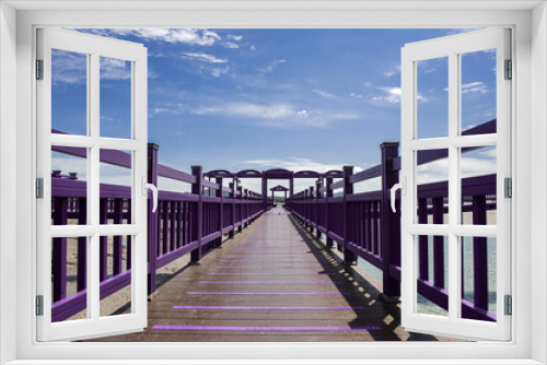 Fototapeta Naklejka Na Ścianę Okno 3D - The beautiful purple color wooden bridge background  blue sky