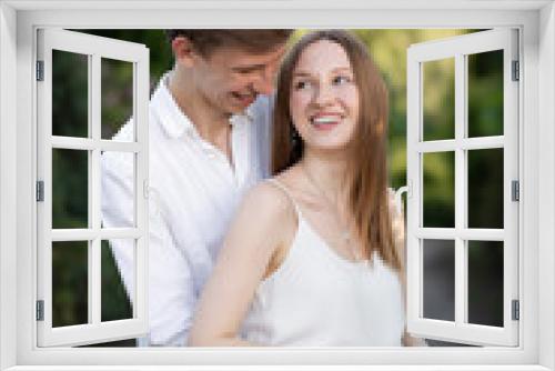 Beautiful young couple holding. Girl  and guy in the park. Outside on nature. Happy couple