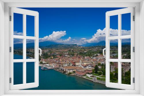 Fototapeta Naklejka Na Ścianę Okno 3D - Lazise, Lake Garda, Italy. Aerial view of the historic part of Scaliger Castle of Lazise in the background cumulus clouds in the blue sky