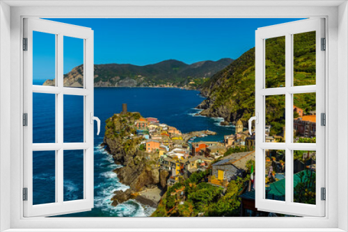 Fototapeta Naklejka Na Ścianę Okno 3D - A view along the Cinque Terre coast towards the colourful village of Vernazza, in the summertime