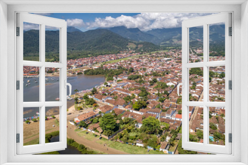 Fototapeta Naklejka Na Ścianę Okno 3D - Aerial view to historic town Paraty and harbour, green mountains in background, sunny day, Unesco World Heritage, Brazil
