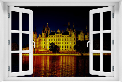 Fototapeta Naklejka Na Ścianę Okno 3D - Schwerin Castle illuminated at night. Germany