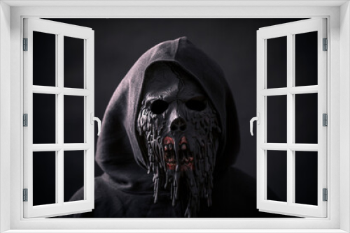 Fototapeta Naklejka Na Ścianę Okno 3D - Scary figure in hooded cloak with mask
