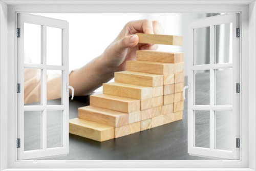 Fototapeta Naklejka Na Ścianę Okno 3D - Hands of businesswomen playing wooden block game. Concept Risk of management and strategy plans for business growth and success