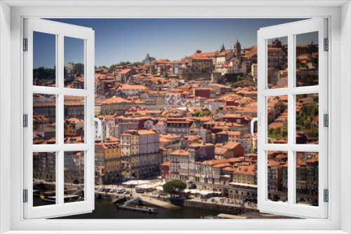 Fototapeta Naklejka Na Ścianę Okno 3D - Colorful houses of Porto Ribeira, traditional facades, old multi-colored houses with red roof tiles on the embankment in the city of Porto, Portugal. Unesco World Heritage site.