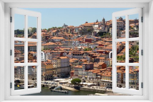 Fototapeta Naklejka Na Ścianę Okno 3D - Colorful houses of Porto Ribeira, traditional facades, old multi-colored houses with red roof tiles on the embankment in the city of Porto, Portugal. Unesco World Heritage site.