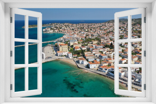 Fototapeta Naklejka Na Ścianę Okno 3D - Aerial drone bird's eye view photo of picturesque neoclassic houses in historic and traditional island of Spetses with emerald clear waters, Saronic Gulf, Greece
