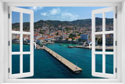 Fototapeta Naklejka Na Ścianę Okno 3D - Aerial drone bird's eye view photo of picturesque neoclassic houses in historic and traditional island of Spetses with emerald clear waters, Saronic Gulf, Greece