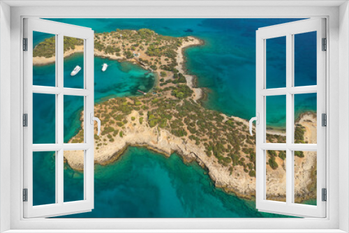 Fototapeta Naklejka Na Ścianę Okno 3D - Aerial drone photo of Hinitsa bay a popular anchorage crystal clear turquoise sea bay for yachts and sailboats next to Porto Heli, Saronic gulf, Greece